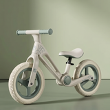 Bicicletă fără pedale pliabilă verde matcha — vedere laterală